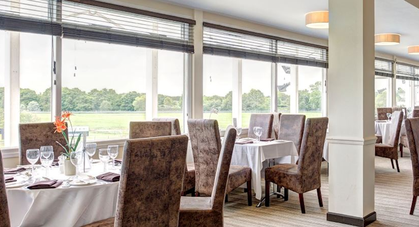 Elegant dining space at Nottingham Racecourse for corporate events and meetings. - Banner