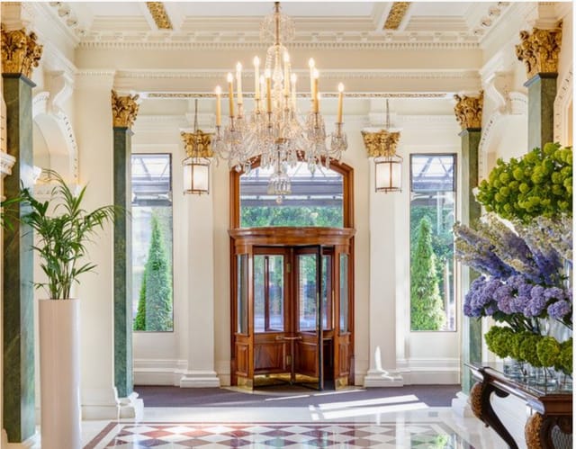 Elegant lobby of The Shelbourne with grand chandelier, perfect for high-end events.