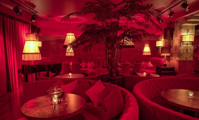 Stylish Bourbon Bar lounge with warm lighting, perfect for cocktail receptions and networking.