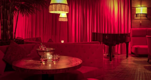 Luxurious Bourbon Bar with plush seating, ideal for upscale events and networking.