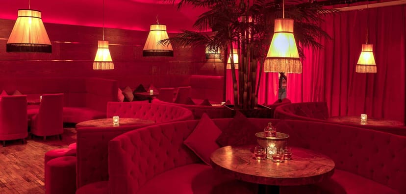 Luxurious Bourbon Bar lounge with plush seating, perfect for cocktail receptions and private parties.