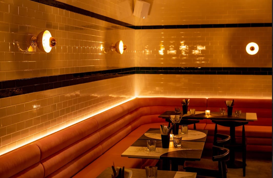 Stylish lounge venue with warm lighting for intimate gatherings and networking events.