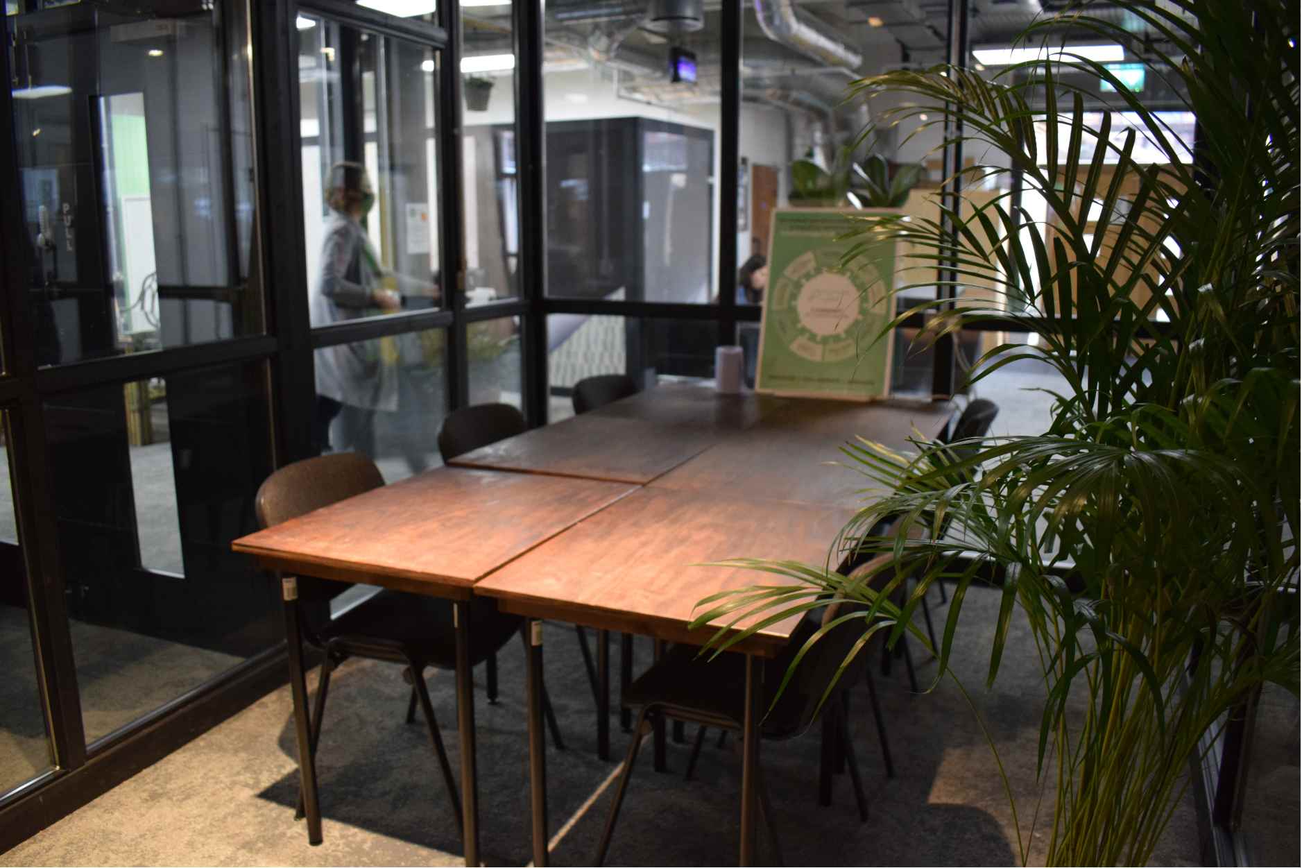 Modern Copper Meeting Room with wooden table, ideal for professional brainstorming sessions.