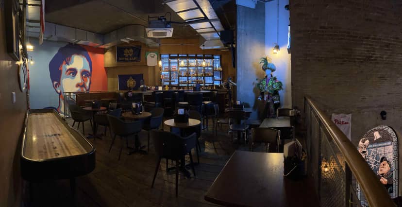 Nick Foles Bar with vibrant mural, ideal for networking events in Passyunk Avenue.