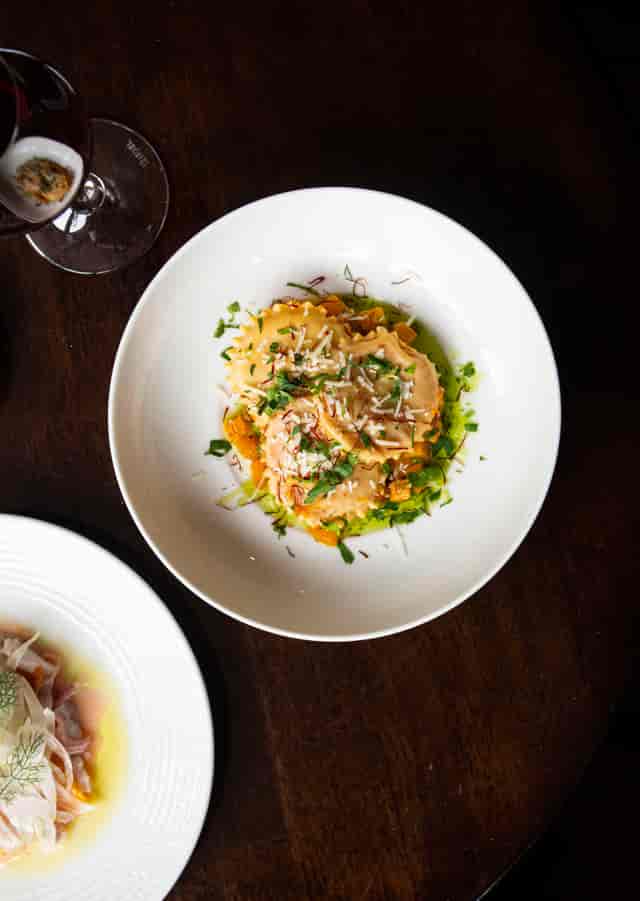 Upscale ravioli dish with herbs at Vienna Salon, perfect for event catering.