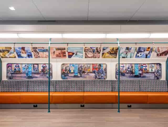 Central Park Suite subway train interior with vibrant artwork for events and networking.
