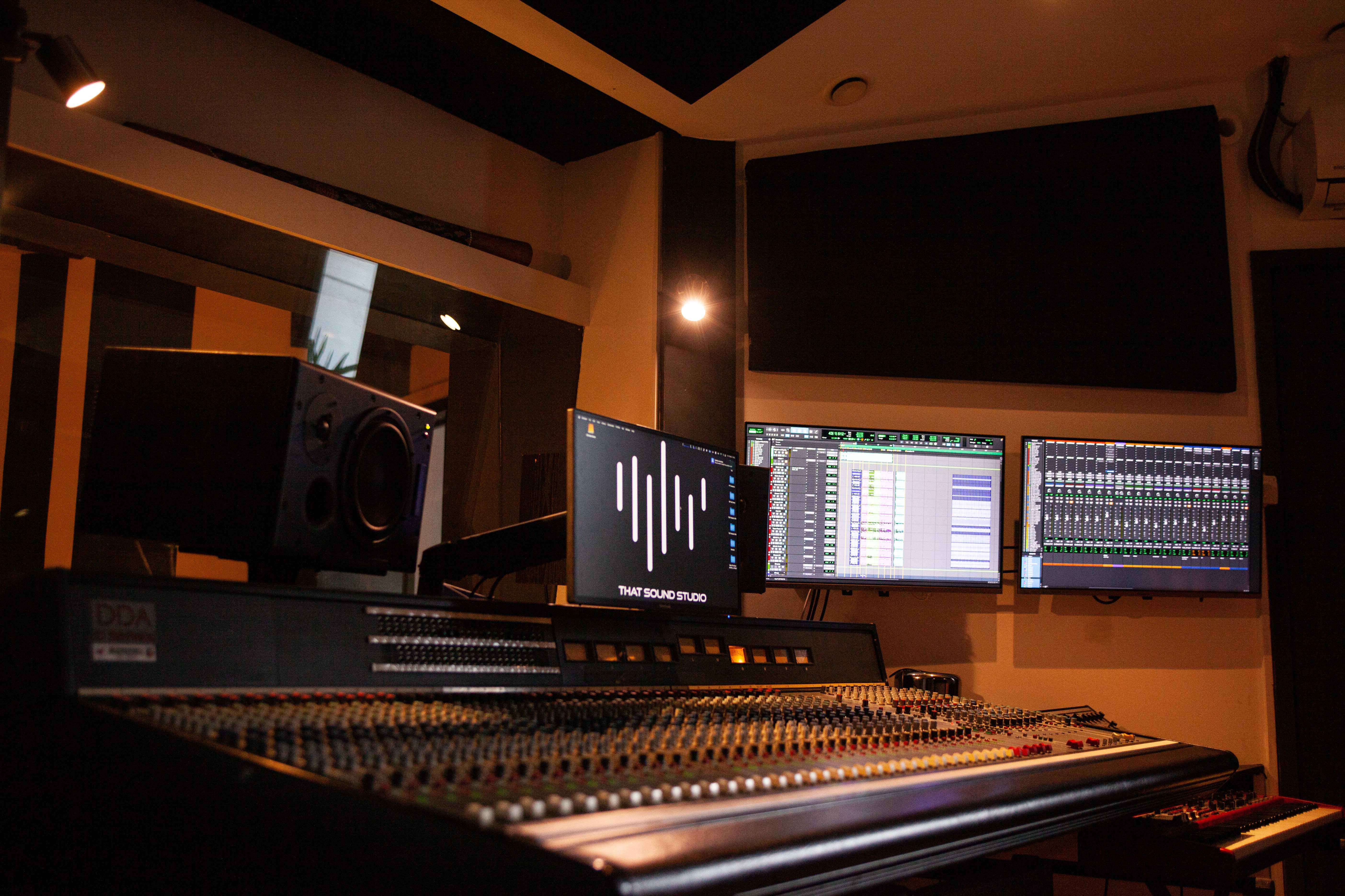 Professional audio mixing studio with monitors for live event sound production. - Banner