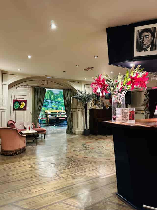 Elegant event space with floral decor, perfect for intimate gatherings or corporate meetings.