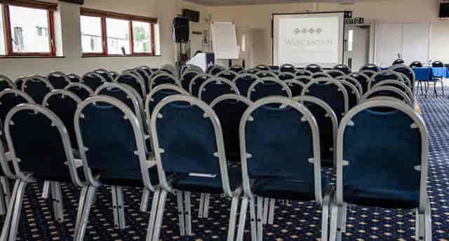Meeting space at Wincanton Racecourse with organized chairs for seminars and workshops.