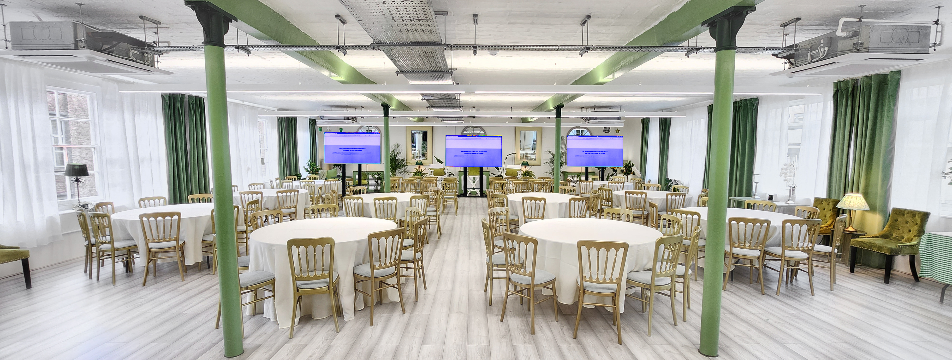Versatile event space with round tables, ideal for meetings and networking events. - Banner