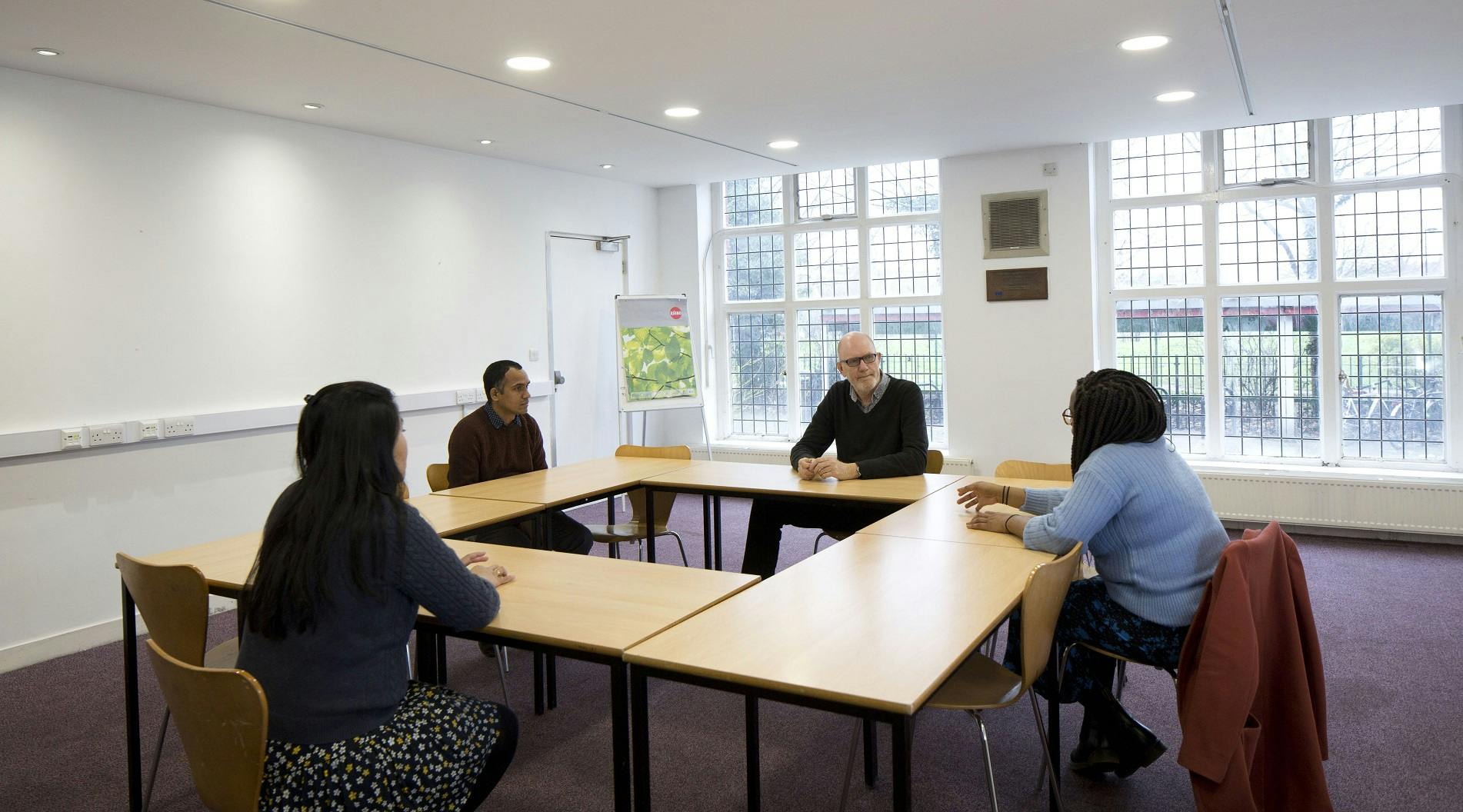 Scott Room in Oxford House: intimate meeting space with large windows for workshops and discussions.