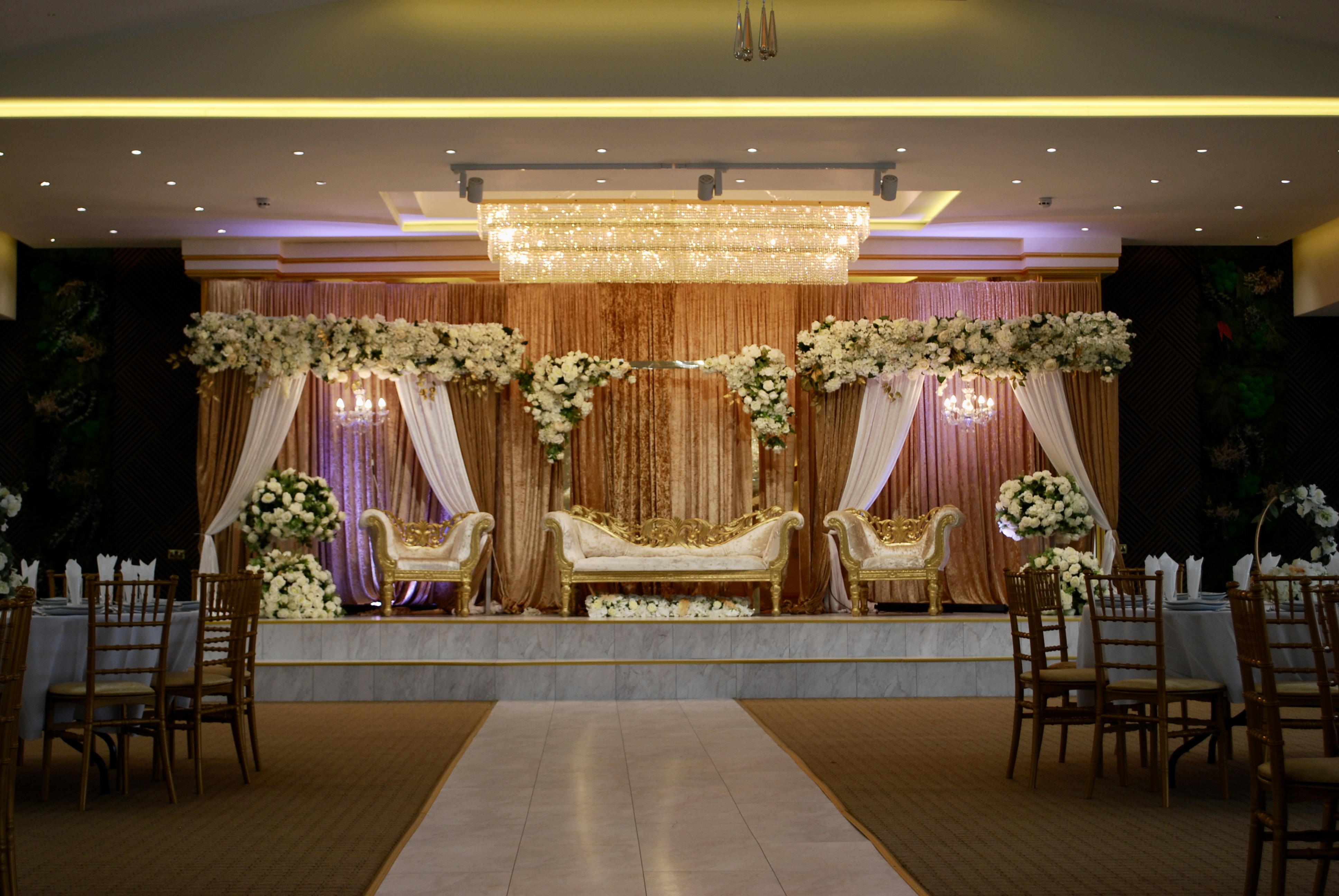Elegant Main Hall in Crystal Suite, perfect for weddings and upscale events with floral decor. - Banner