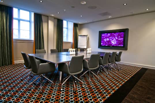 Modern meeting room at Sofitel Legend Amsterdam with ergonomic chairs for productive sessions.