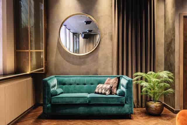 Teal velvet sofa in Byrd Hotel Lounge, Hart Shoreditch: luxury event space for executive networking.