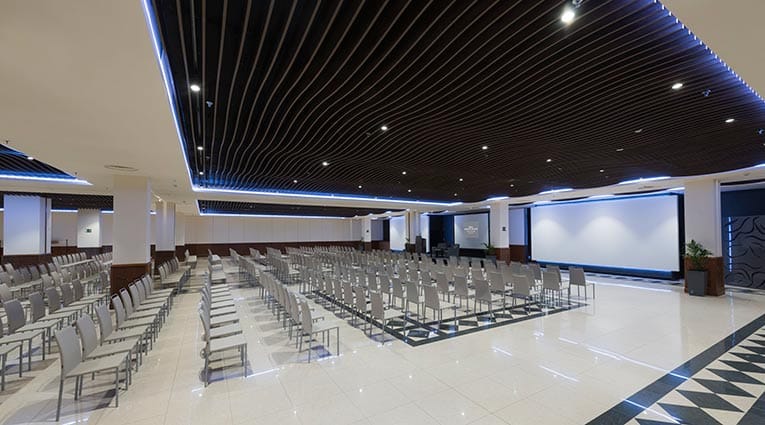 Spacious meeting room with modern chairs, ideal for conferences and presentations.
