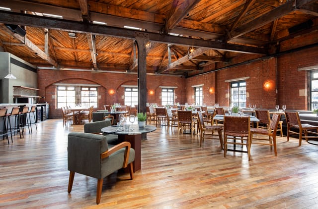 Spacious Timber Loft venue with exposed brick, perfect for events and receptions.