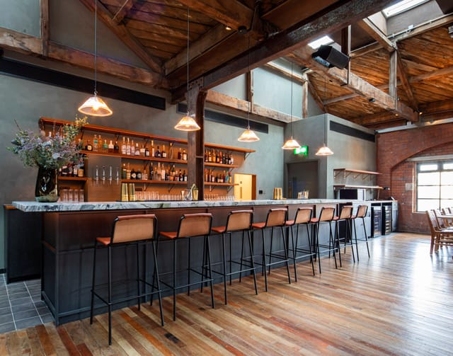 Timber Loft bar with rustic design, ideal for networking events and cocktail receptions.