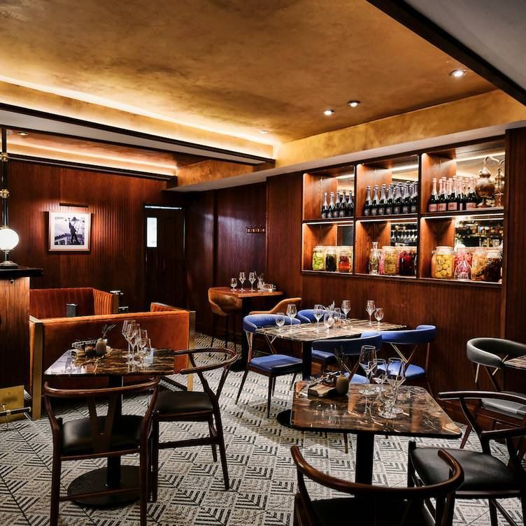 Elegant dining space in The Black Book, perfect for private events and networking receptions. - Banner