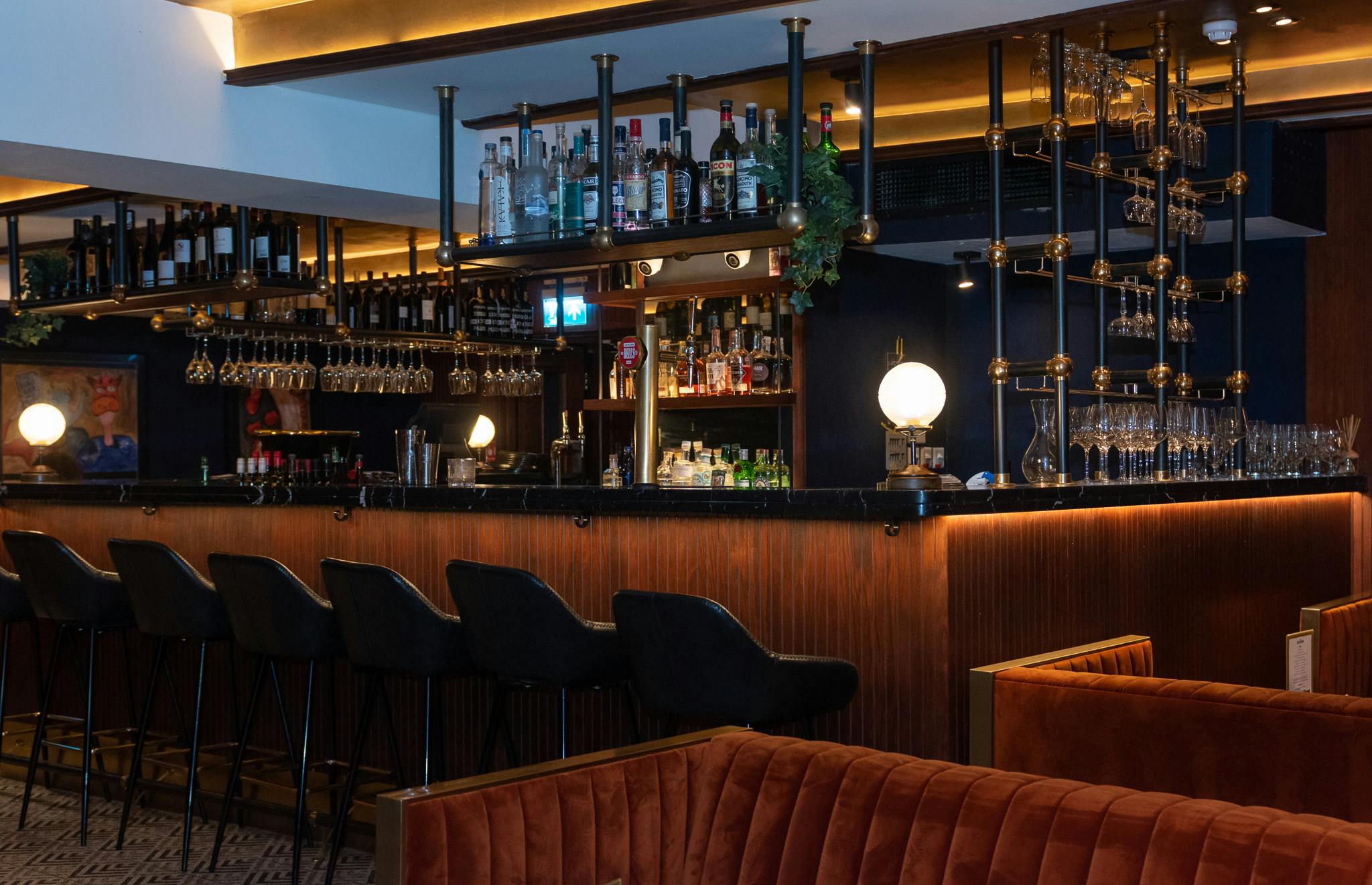 Stylish bar area in The Black Book, perfect for networking events and cocktail receptions.