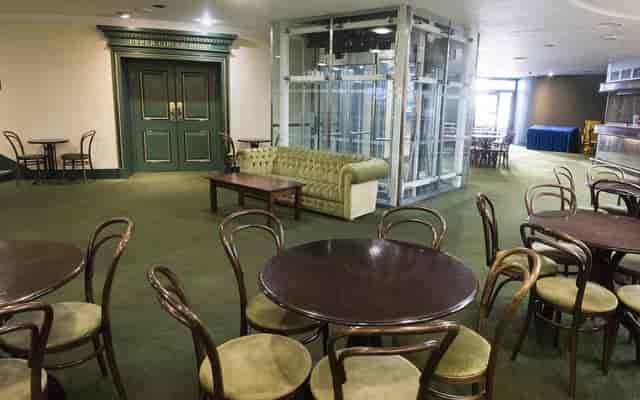 Upper Circle Foyer at Royal Concert Hall, versatile event space with green carpet seating.
