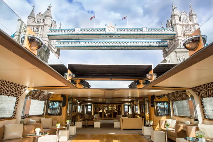 Silver Barracuda boat event space with elegant decor and Tower Bridge view, perfect for upscale events.