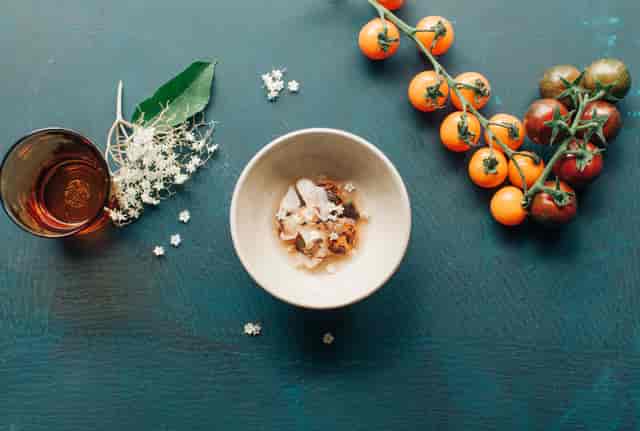 Elegant table setting with fresh ingredients for a culinary event at Great Guns Social.