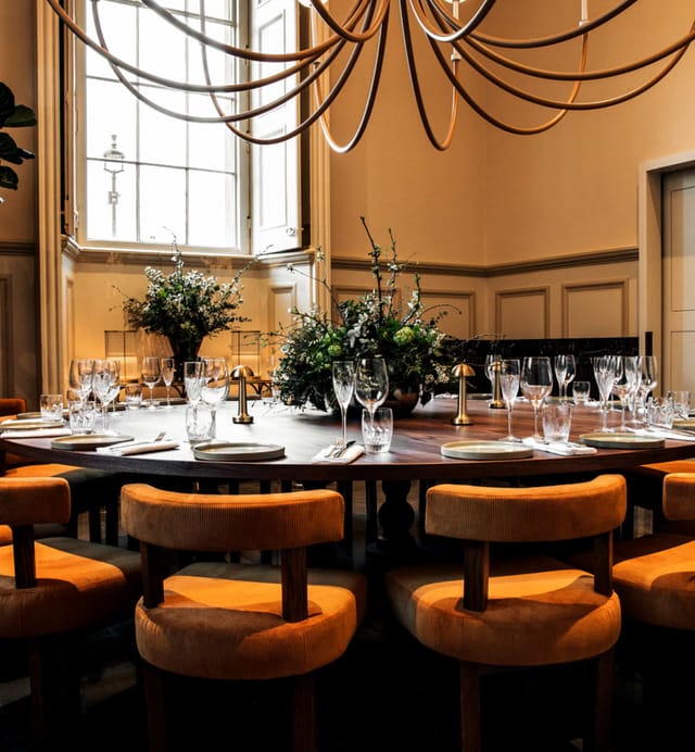 Elegant private dining room with round table, perfect for upscale events and meetings.