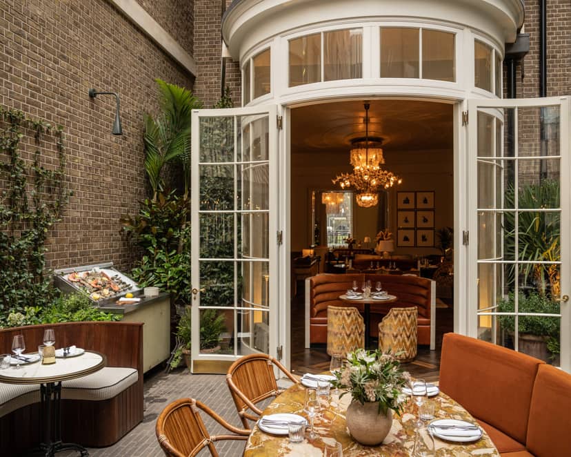 Elegant event space in The Maine Mayfair with lush greenery for upscale gatherings.
