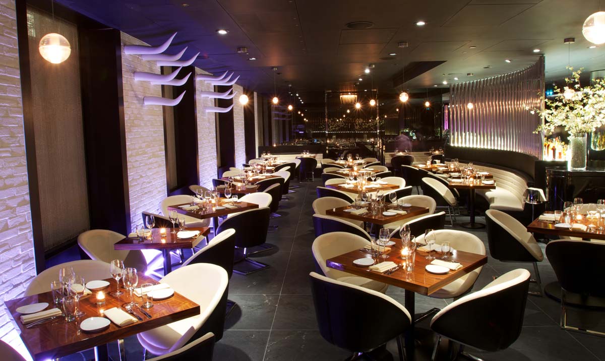 Private dining room at STK London with elegant tables for upscale events and gatherings.