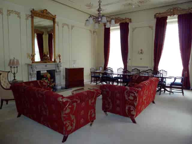 Sophisticated meeting space with plush red sofas, ideal for formal events and networking.