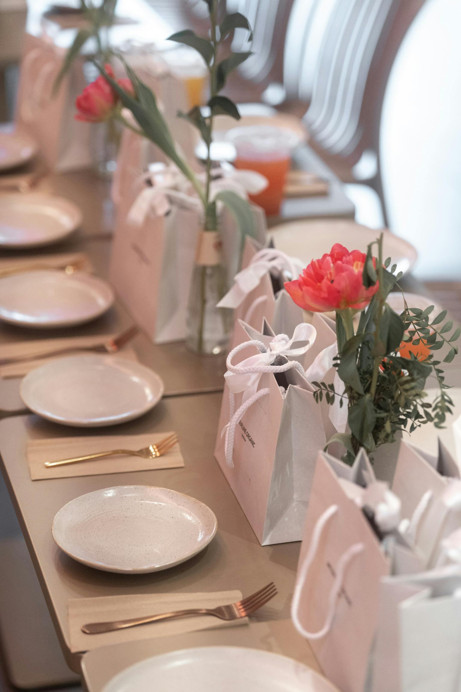 Elegant table setting at Vita Cafe with gold utensils for a fitness event.