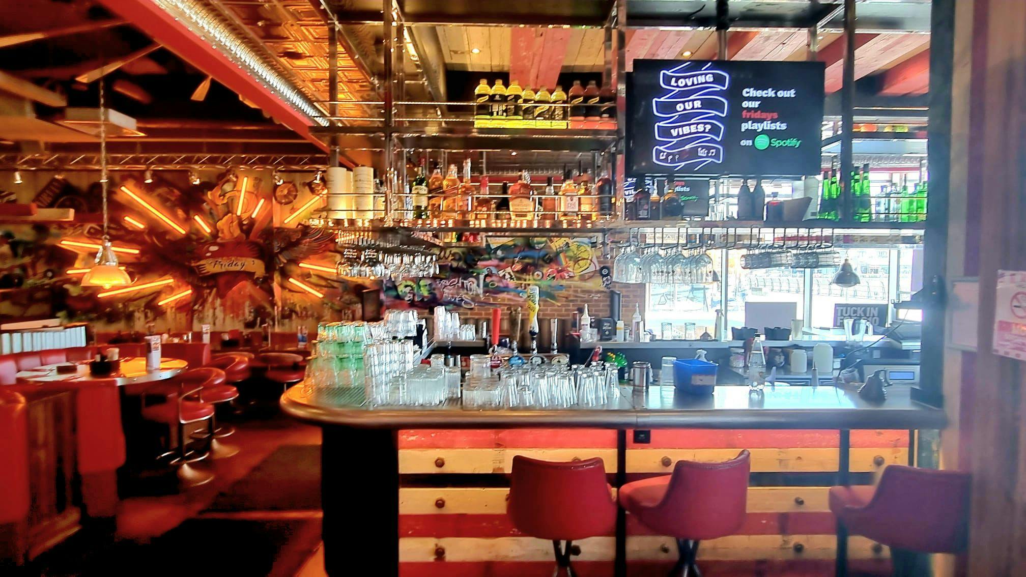 Vibrant bar area at TGI Friday's Brighton Marina for casual networking events.