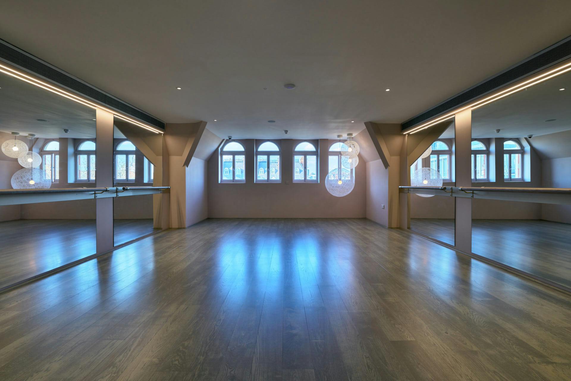 Light Loft event space with large windows, ideal for corporate meetings and social gatherings.