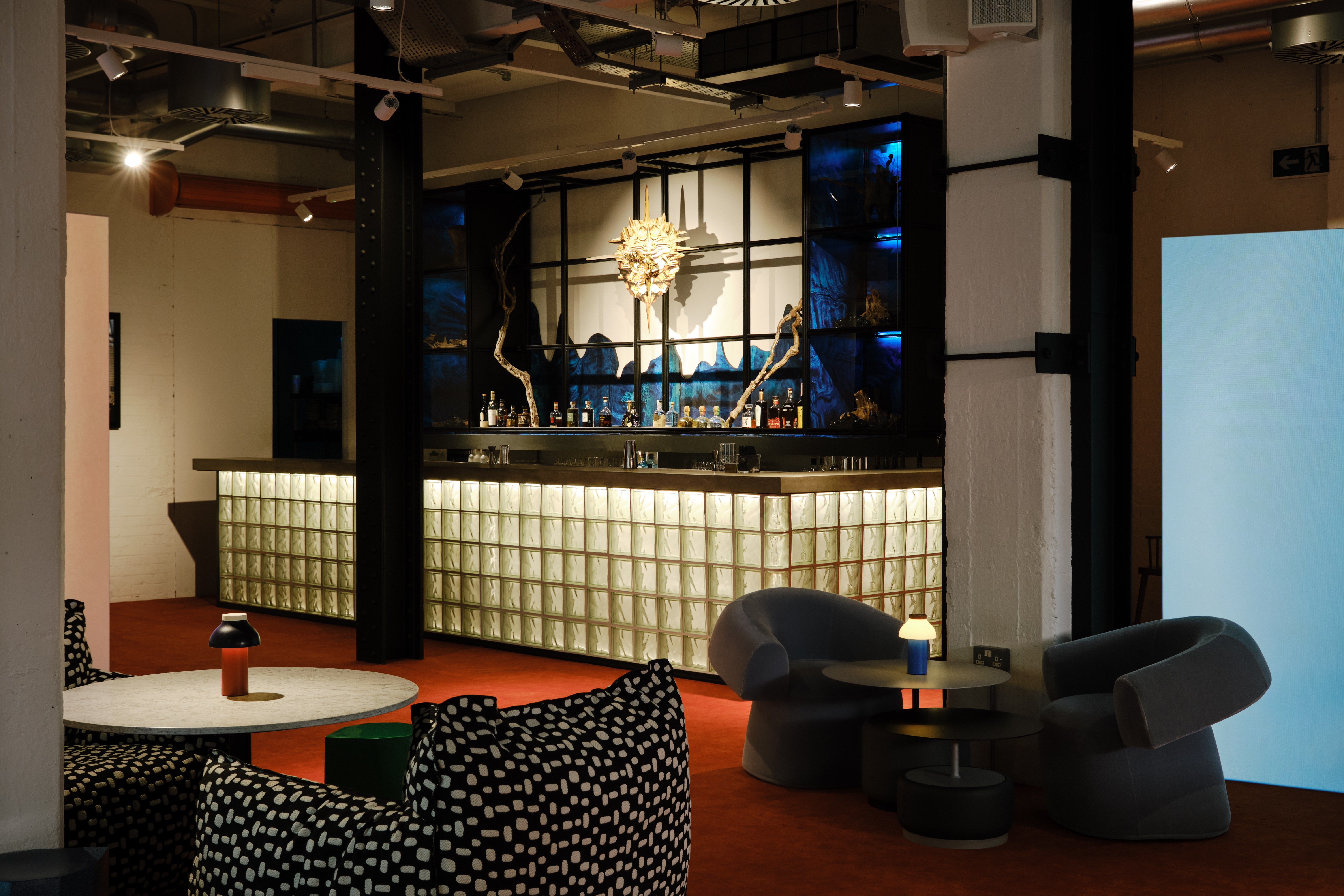 Modern Shoreditch Arts Club lounge with stylish bar, perfect for networking events. - Banner