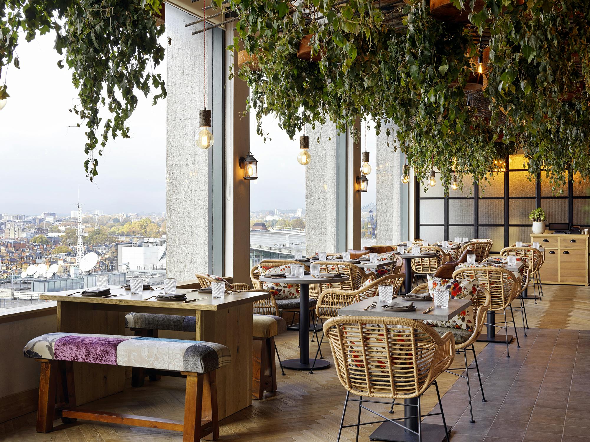 Stylish dining space with greenery at The Treehouse Hotel, perfect for events and meetings.