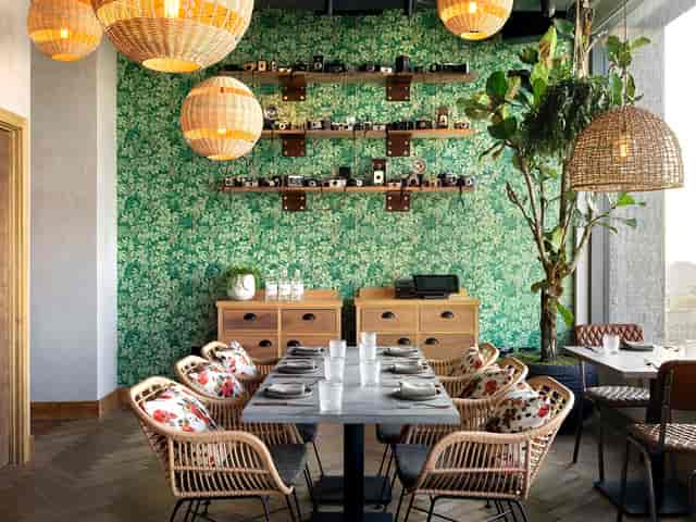 Madera Semi-Private dining space with floral wallpaper for intimate meetings and events.