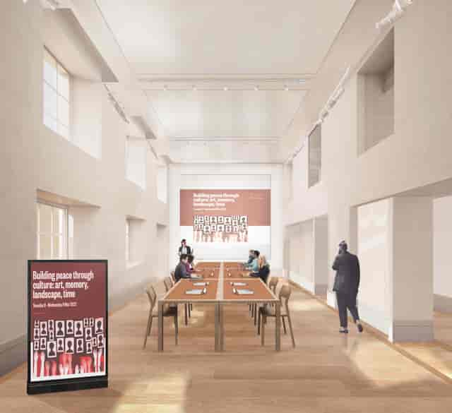Modern lecture room with long tables, ideal for workshops and conferences.