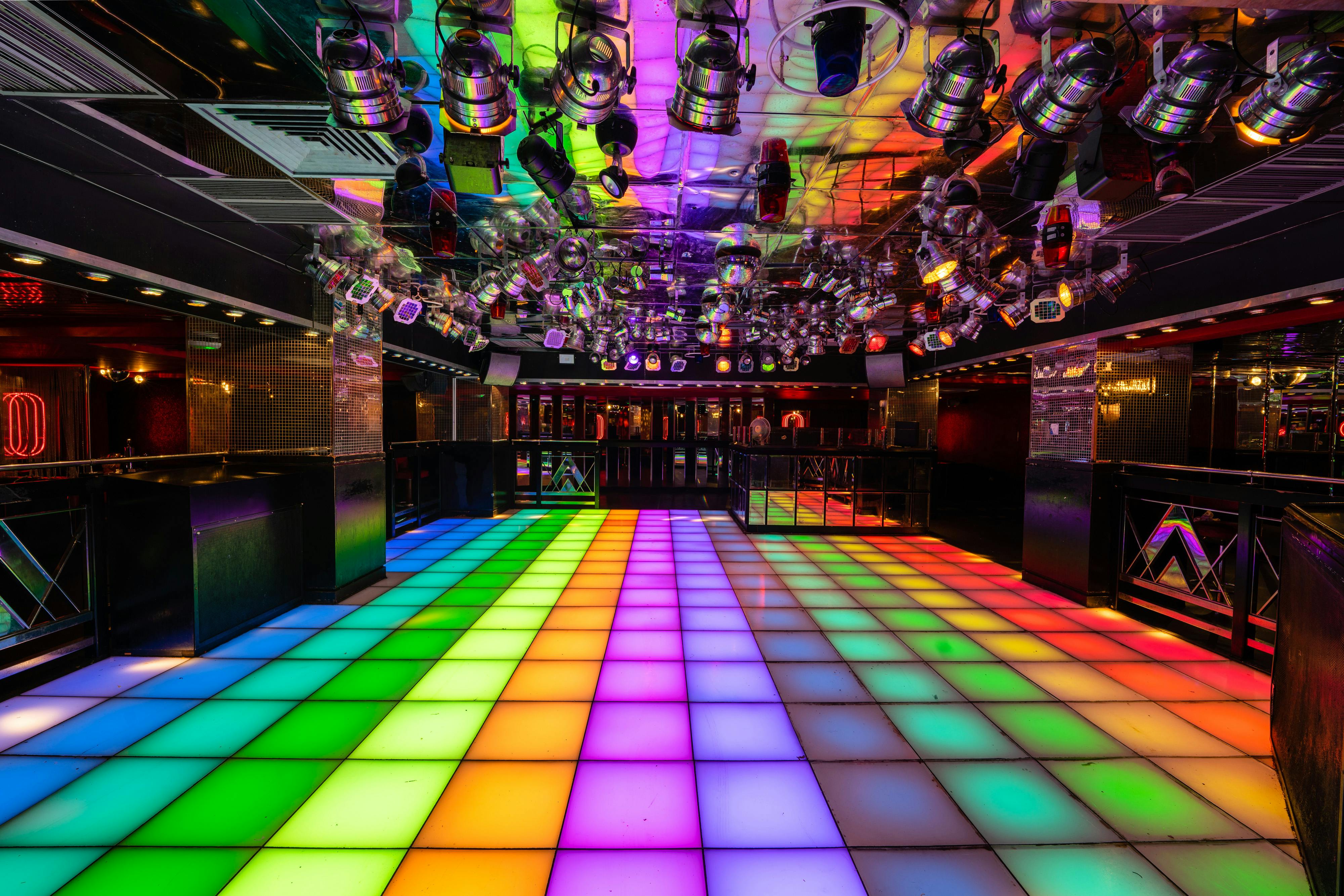 Disco event at PRYZM Bristol with colorful LED dance floor and mirrored ceiling.