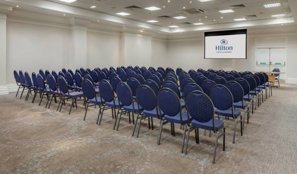 Wembley Suite at Hilton Nottingham, blue chairs arranged for a corporate conference.