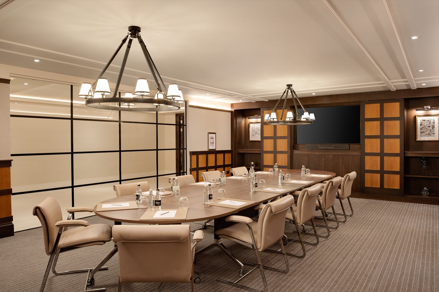 Elegant meeting room with oval table at Primrose, Fairmont Windsor Park for corporate events.