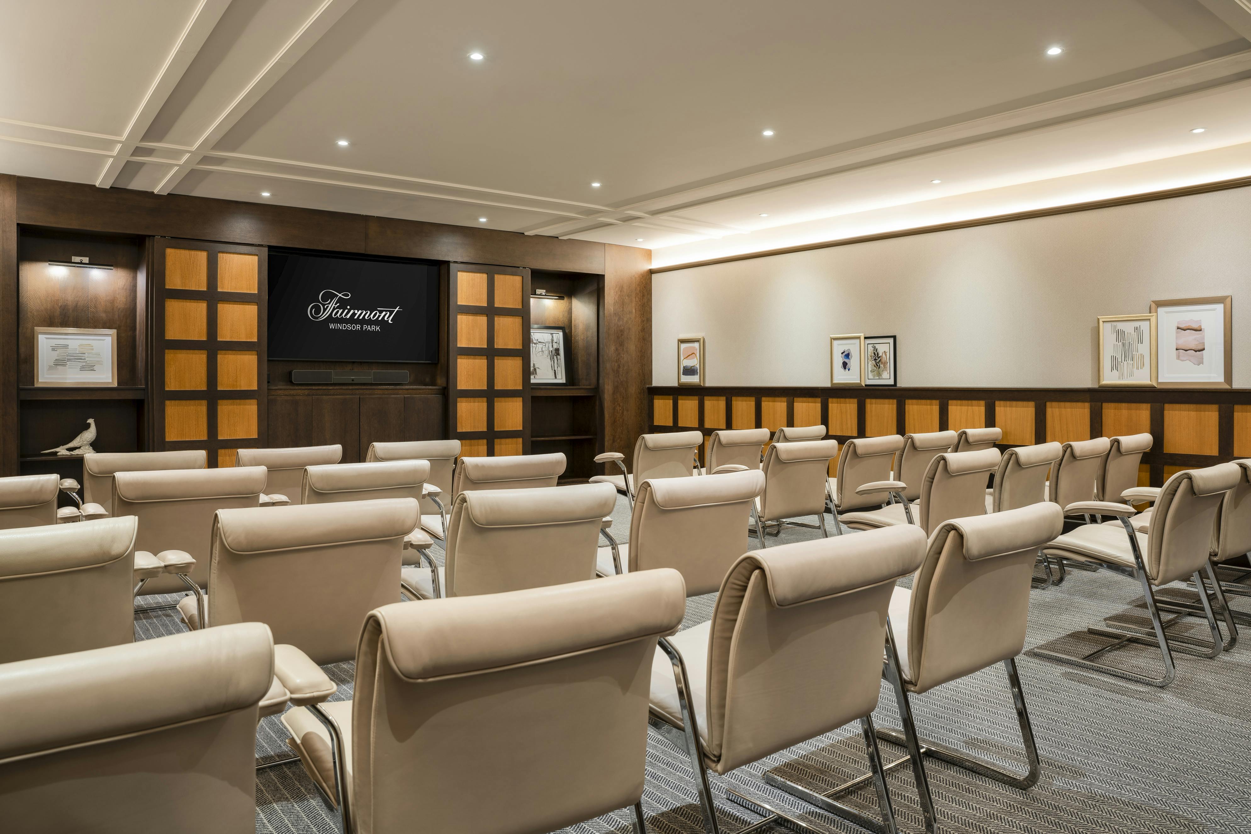 Modern meeting room at Fairmont Windsor Park, ideal for presentations and workshops.