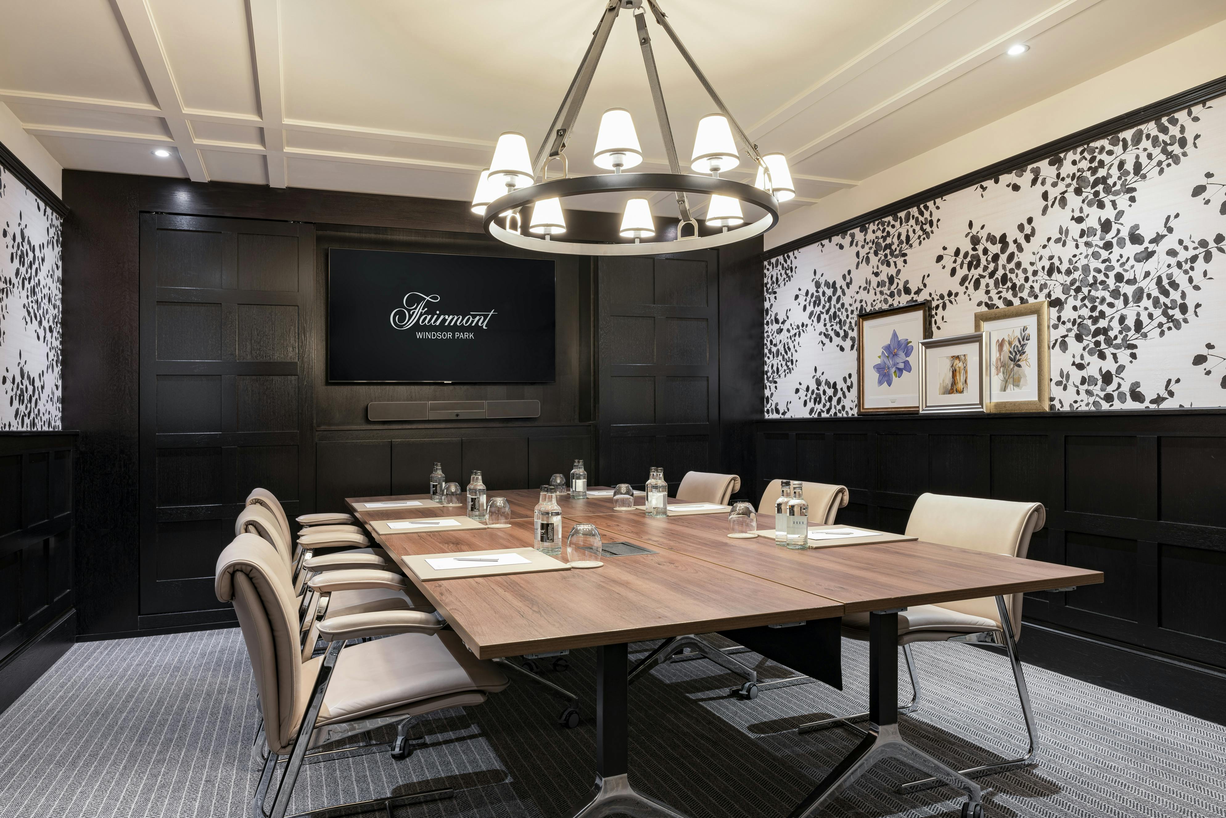 Sophisticated meeting room with wood paneling for corporate events at Fairmont Windsor Park.