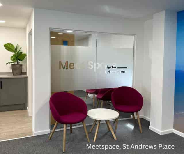 Modern hot desks in a vibrant meeting space for collaborative brainstorming sessions.
