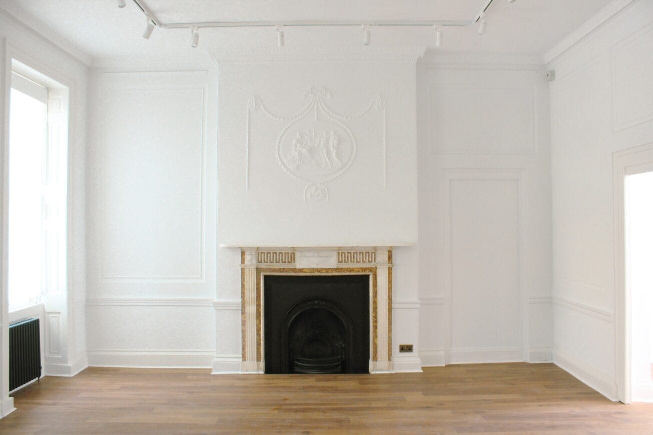 Elegant Morrell Room with fireplace, perfect for meetings and workshops in Bloomsbury.