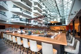 Flagg Ballroom bar area with high ceilings, ideal for networking events and gatherings.