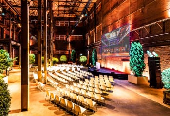 Versatile event space at Middle Factory, ideal for conferences with spacious layout and stage.