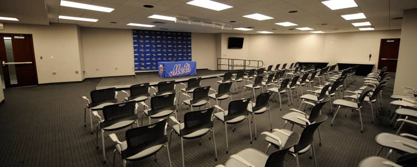 Press conference room at Citi Field with modern seating and branded backdrop.