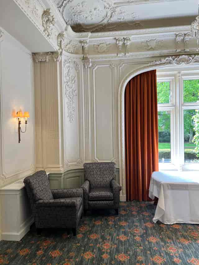 Elegant meeting space with lavender decor at Warren House Hotel, perfect for gatherings.