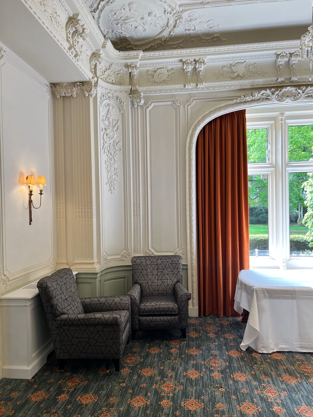 Elegant meeting space with lavender decor at Warren House Hotel, perfect for gatherings.