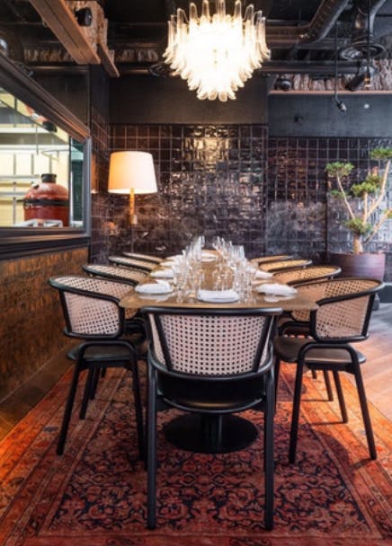 Elegant Chef's Table at Arros QD, perfect for intimate corporate events and networking dinners.